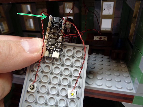 The green circle in the second photo shows where the green light should be mounted, and the blue circle shows where the warm white light should be mounted.