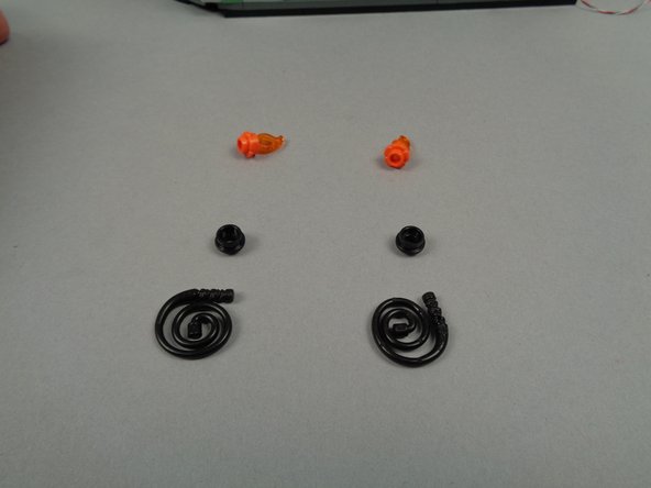 As shown in the third photo for this step, disassemble the two torches.  You will replace the black round 1x1 plates in the next step.