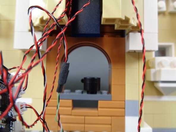 As shown in the photos for this step, continue re-assembling the stove.  By the end of this step, your stove should be completely re-assembled as shown in the third photo.