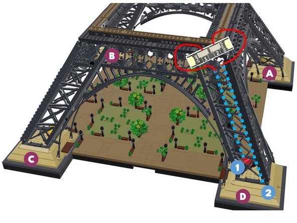 Next, you will rotate your Eiffel tower in a clockwise direction again-- this is the same direction the loose control cable from the previous step is pointing toward.