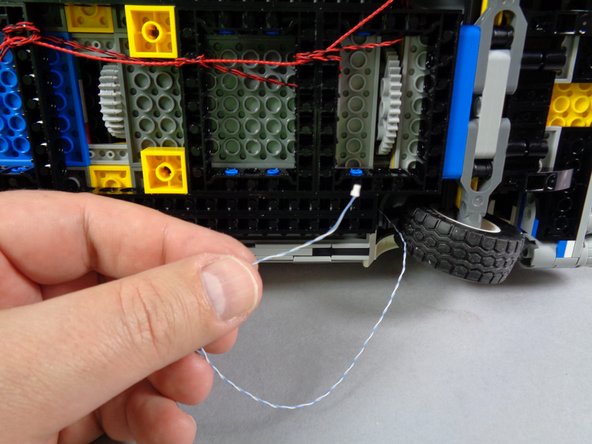 Next you will route the blue/white wire of the hood spot light and connect it to the BRANCH09X adapter board.