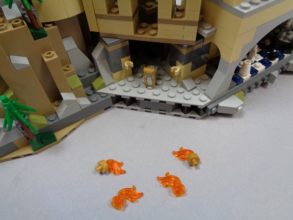 Remove the four flame assemblies from the Mirror of Erisred room as shown in the first photo.