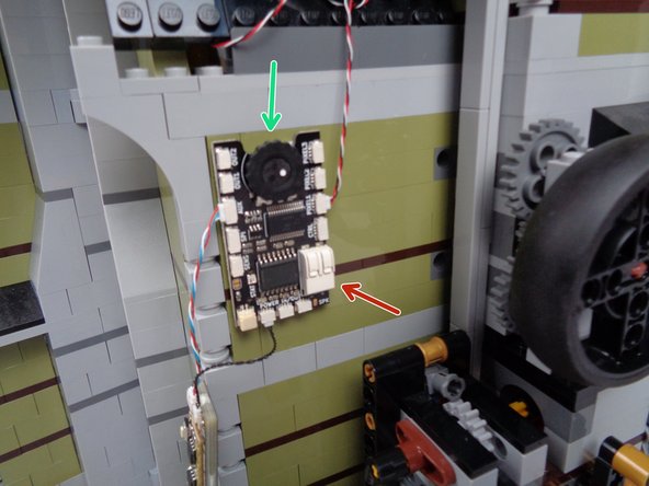 Attach the main effect controller to the back wall as shown in the photo for this step.