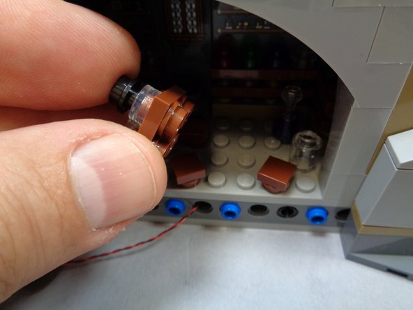 As shown in the photos for this step, you can now remove the table and cauldron from the Potions Class.