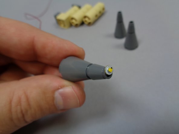 When you have fed the wire through each tower top, the light should look similar to the light shown in the third photo.