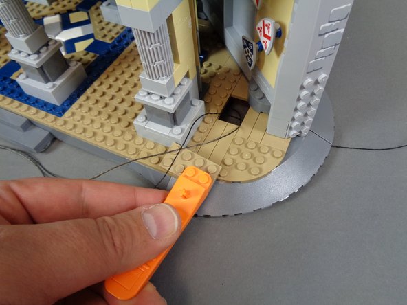 You should now have two cables coming into the main castle interior through the floor: one 2-wire cable (black) and one 3-wire cable (either red or black).