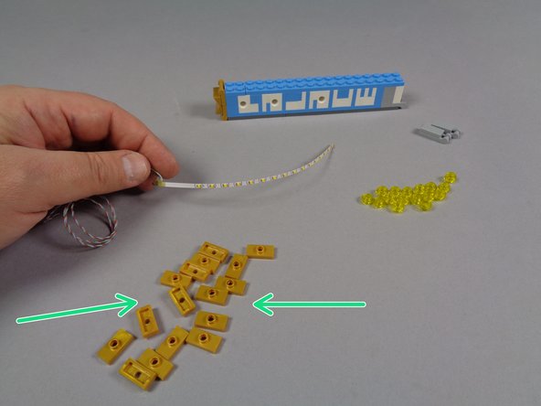 Also remove the 16 replacement gold 1x2 jumper plates from Bag 1 as shown by the green arrows in the second photo.
