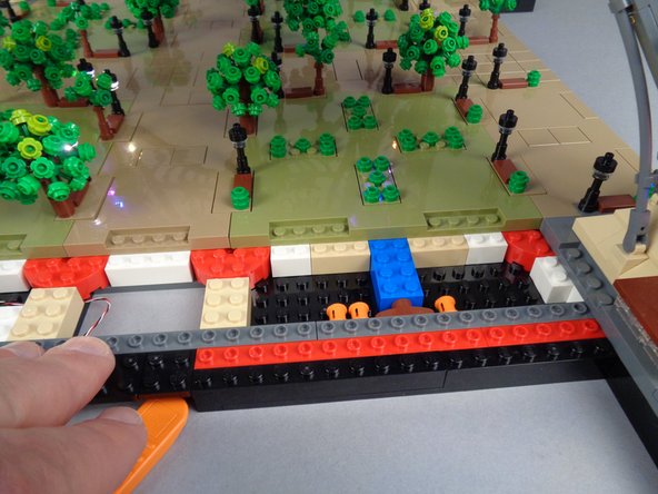 Next you will remove Panel 2F as shown in the photos for this step.  This will allow you to finish running the control cable to where you will work on the next group of lamp posts.