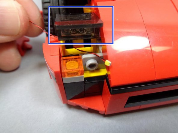 Next you will mount the third LED in the headlight bunch into the lower front position.