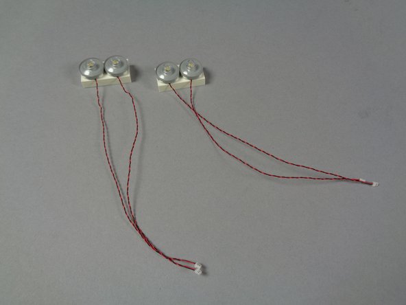 The third photo for this step shows how the headlights should look when re-attached.