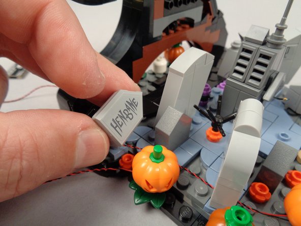 As shown in the first photo for this step, remove the HENBANE tombstone.