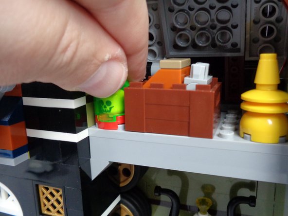 As shown in the photos for this step, remove the skull jar assembly from the attic, and separate the pieces.