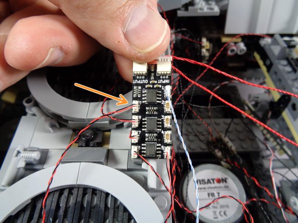 As shown by the orange arrow in the third photo, connect the underfloor light to plug #9 on the BRANCH09X adapter board.