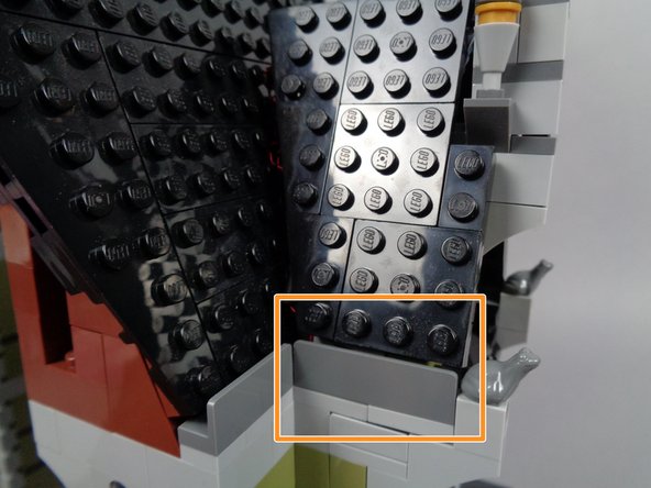 As a final check before proceeding, look at the lightning LED light as shown by the green arrow in the third photo for this step.  Make sure it is still angled back toward the mansion, and adjust if needed by gently bending the LED.