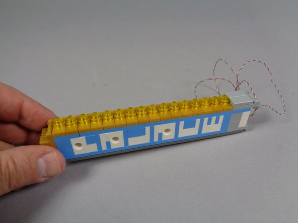 If the light strip lights are not aligned with the holes in the jumpers, go back a few steps, remove the jumpers again, and re-position the light strip.