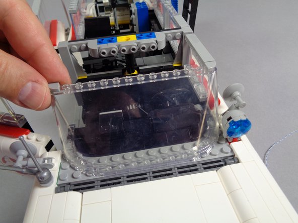 As shown by the yellow circle in the second photo, make sure the plate does not pull on, pinch, or break the spot light wire when you re-attach it.