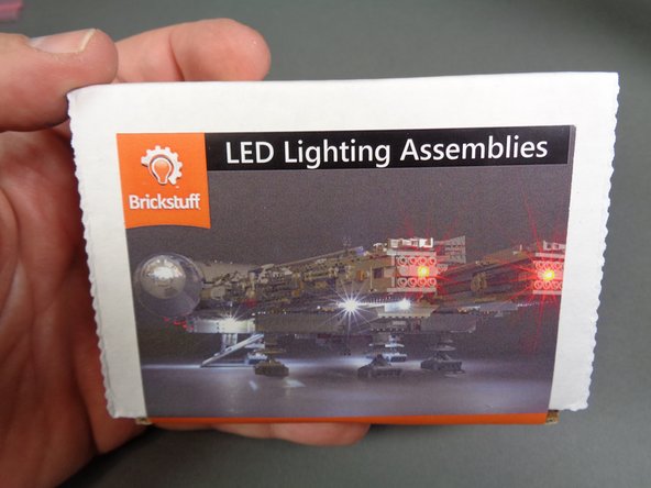 As shown in the photos for this step, open the box labeled LED Lighting Assemblies.