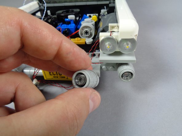 As shown in the first photo for this step, remove the second lower headlight and install the LED light following the same steps you used for the first lower headlight.