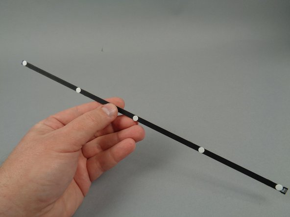 Use five sticky dots per strip as shown.