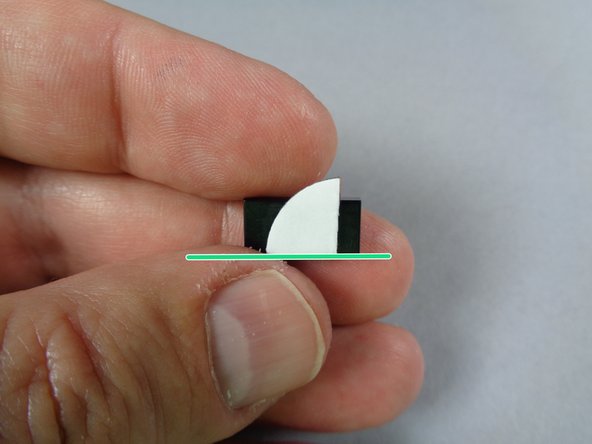 Prepare the third door switch like you did for the second switch, attaching one of the cut glue discs to one of the black 1x2 tiles.