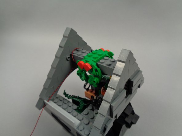 As shown in the photos for this step, re-assemble the rooftop section of Jack's house.