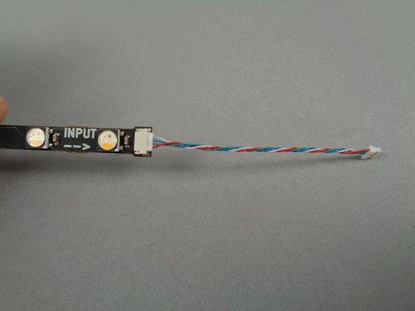 As shown in the photos for this step, connect 4-wires cables to both ends of the 17-LED light strips.