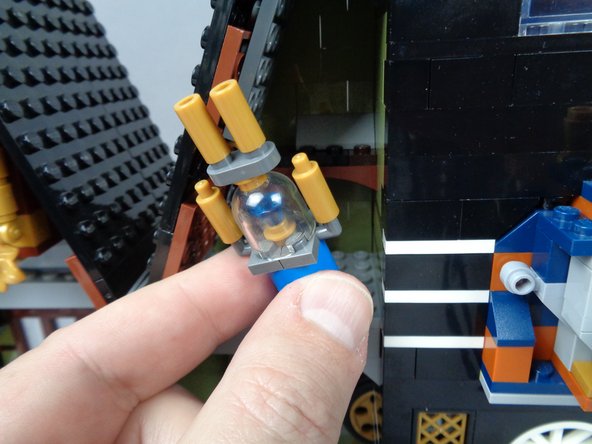 As shown in the photos for this step, remove the jewel case from the left side of the attic, and remove the top section along with the jewel and gold plate base.