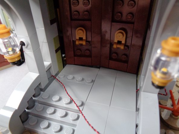 Continue routing the wire for the second front porch light as shown in the photos for this step.