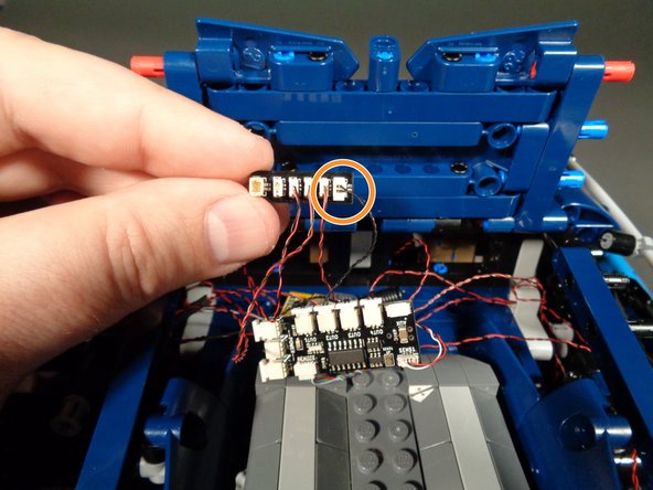 As shown by the orange circle in the photo for this step, re-connect the short black wire with larger plug to one of the large connectors on the BRANCH15 adapter board.  You can connect to either of the large plugs on the BRANCH15.