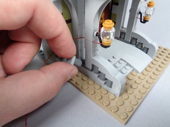 Continue routing the wire for the second front porch light as shown in the photos for this step.