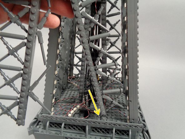 As shown in the photos for this step, you can now re-attach the rear top tower panel.