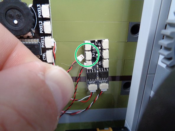 As shown by the green circle in the first photo for this step, connect the lamp LED light wire to plug #2 on the BRANCH06X adapter board.