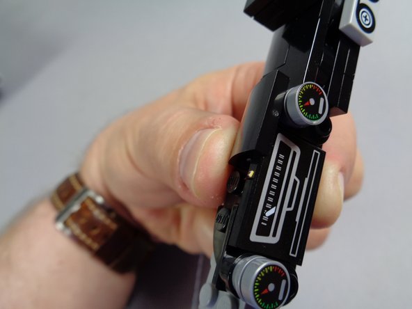 Carefully bend the wire so the light sticks out a small amount above the speedometer.