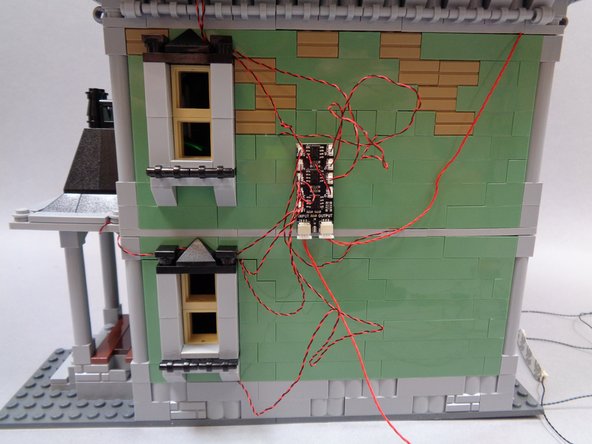 You will have extra light wires in back of the house.  You can use a tweezers or similar tool as shown in the third photo to coil up any excess light wires.