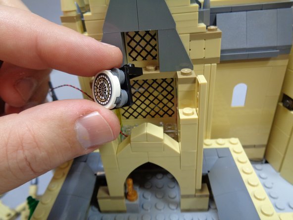 As shown in the first photo, remove the clock and its mounting bracket.