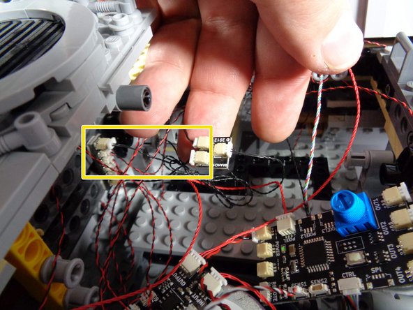 As shown by the green oval in the diagram, you will be looking for a short (1.5&quot;/3.8cm) black connecting cable in the rear of the Falcon, close to where the new TRUNK08 controller board is.