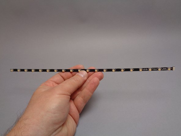 The first photo for this step shows the 20-LED light strip.