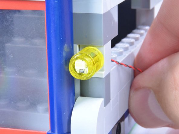 After you think you've sanded enough off each corner of a Micro Light Board, test the fit inside a 1x1 round LEGO® brick.