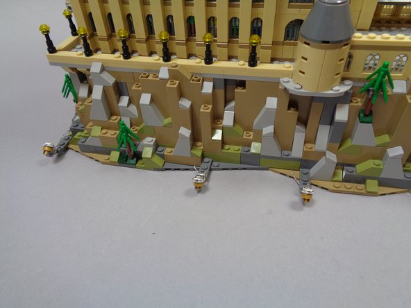 Where you position the spotlights is up to you.  You can adjust the spotlights up or down as needed after they have been mounted-- just make sure to leave enough extra wire close to the spotlight to allow it to move up and down.