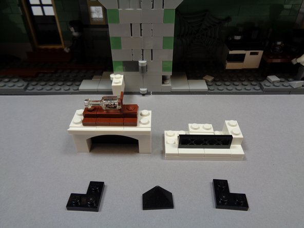 As shown in the first photo, separate the fireplace from its hinge and remove the three black pieces as shown.