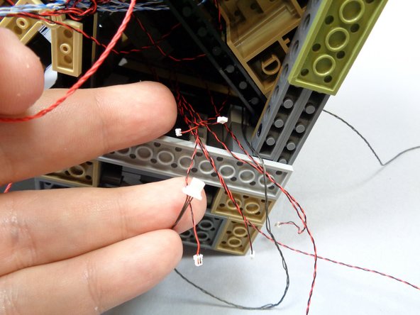 Carefully turn your castle on its side and lay it on a soft, flat surface.