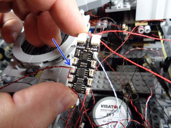As shown by the blue arrow in the third photo, carefully connect the new control panel LED light to plug #8 on the BRANCH09X adapter board.
