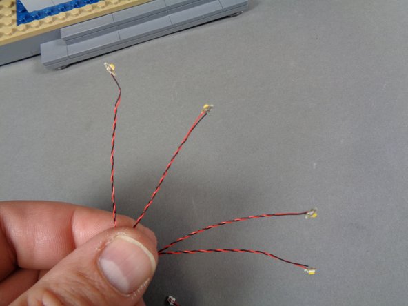 You should still have four warm white Pico LED lights with 12&quot;/30.4cm wires inside the &quot;Lower Level Lights and Parts&quot; bag.  Remove those lights, and also remove four small sticky squares from the bag.