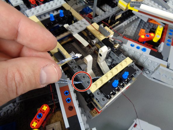 When re-attaching the cap, it is important to make sure that none of the light wires become pinched.