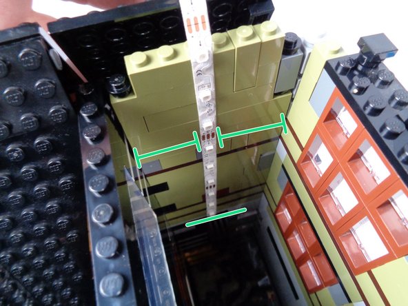 Make sure you are feeding the side of the strip without the connected wire down into the shaft.  The end of the strip with the wire attached will come out the top of the tower.