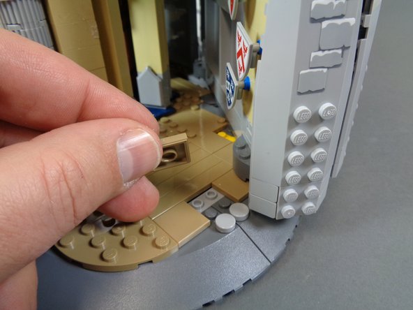 The photos in these steps show the knight statues mounted in the castle, but you will have removed these from your castle at the beginning of the installation process.