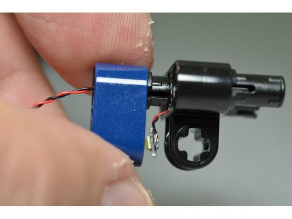 Now you will re-attach the small blue Technic beam to the black mount.