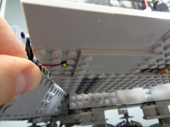 As shown in the second photo, the easiest way to mount the lights is to position them between four studs.