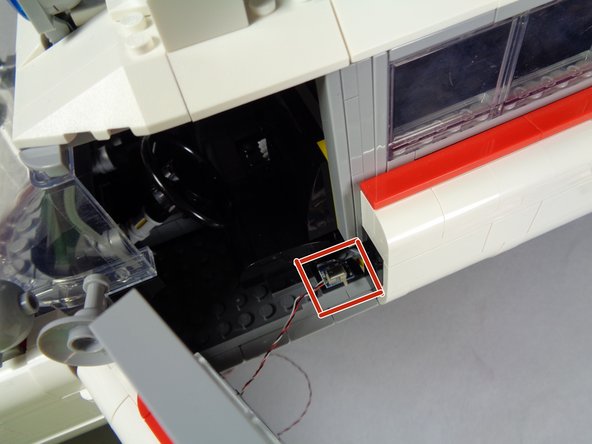 Open the door as shown in the first photo.