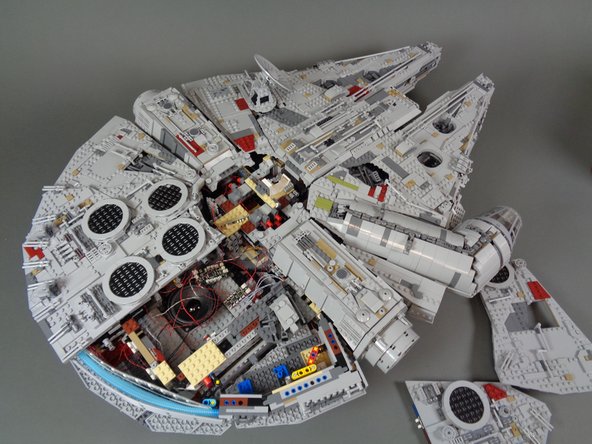 Now it is time to re-attach the top panels on the Falcon, including the tops of the docking bays.  Using the LEGO® instructions if necessary to see how to re-attach the panels, carefully re-assemble your ship.